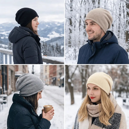 Four people wearing beanies in a snowy landscape with mountains and trees.