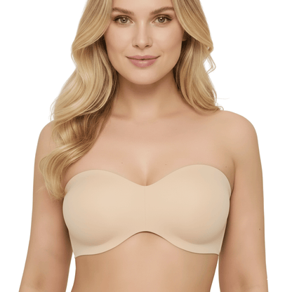 Woman wearing a beige strapless bra on a white background