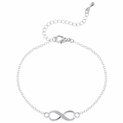 Silver bracelet with infinity symbol on a white background