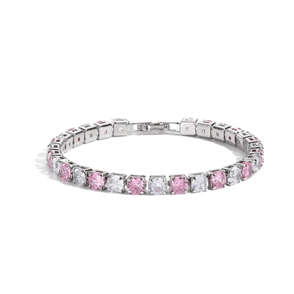 Silver bracelet with pink and clear gemstones on a white background
