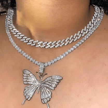 Silver butterfly pendant necklace on a person's neck