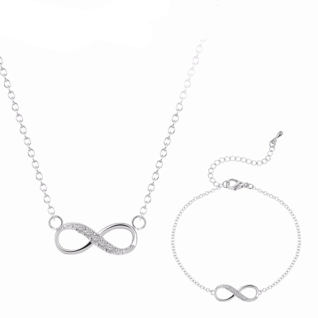 Silver infinity necklace and bracelet set on a white background