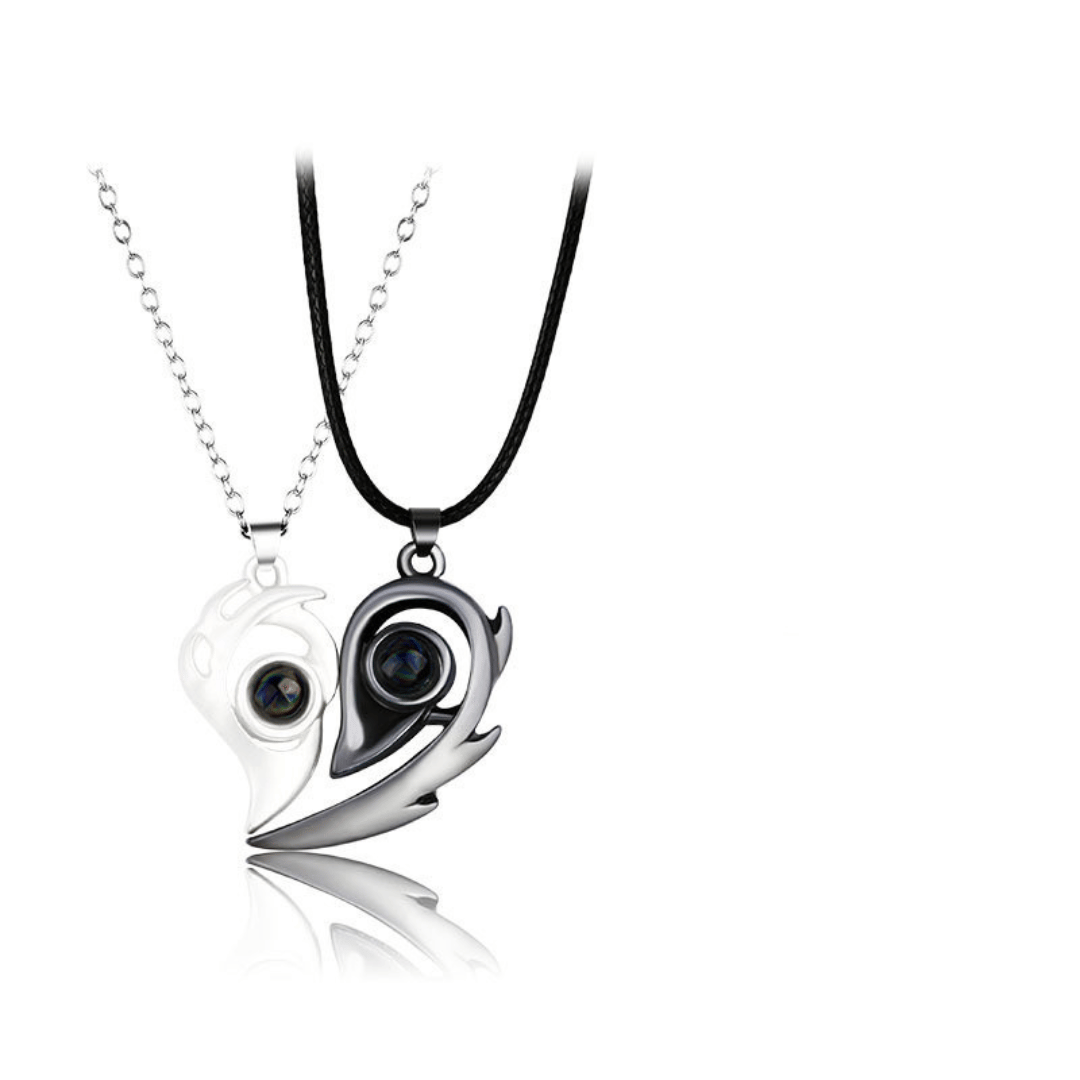 Yin and yang pendant with black and white design on a white background