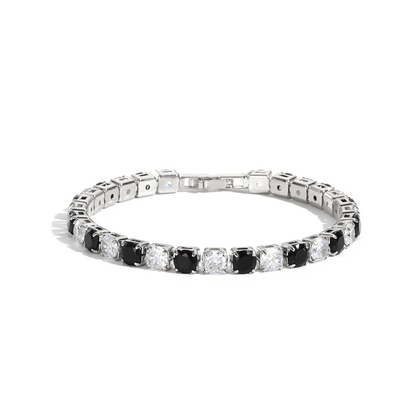 Diamond bracelet with alternating black and clear gemstones on a white background