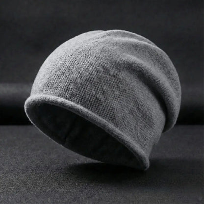 Gray knit beanie on a dark background
